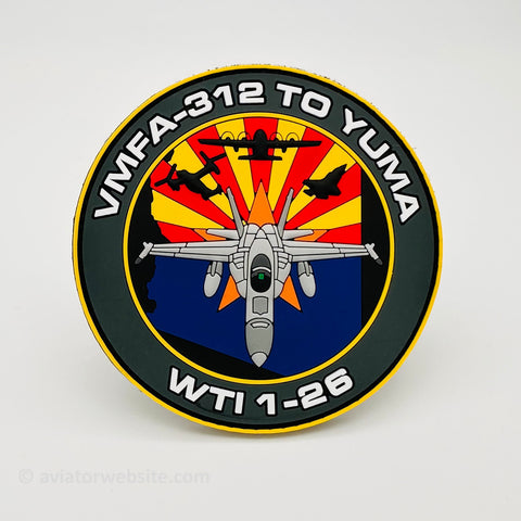 Circular patch with military aircraft design and text on a white background